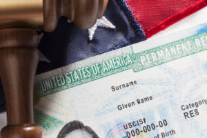 Green card and American flag.