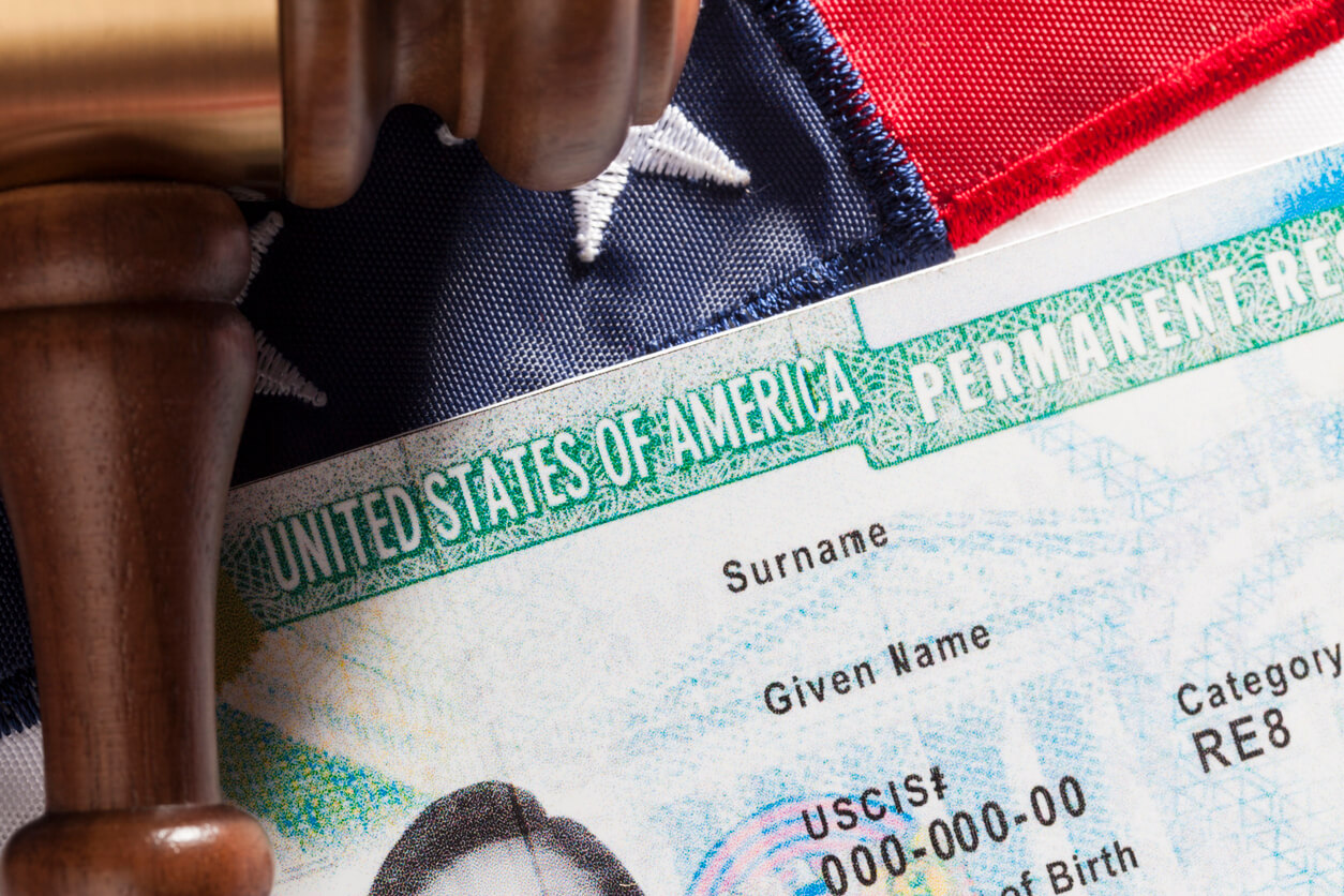 Green card and American flag.